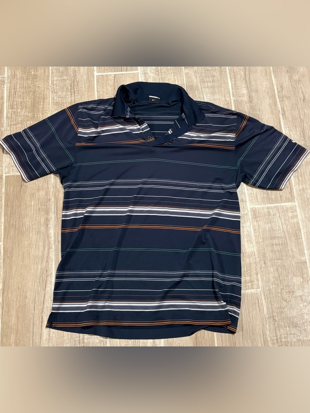 Nike Men's Navy Polo with White, Orange, and Green Stripes